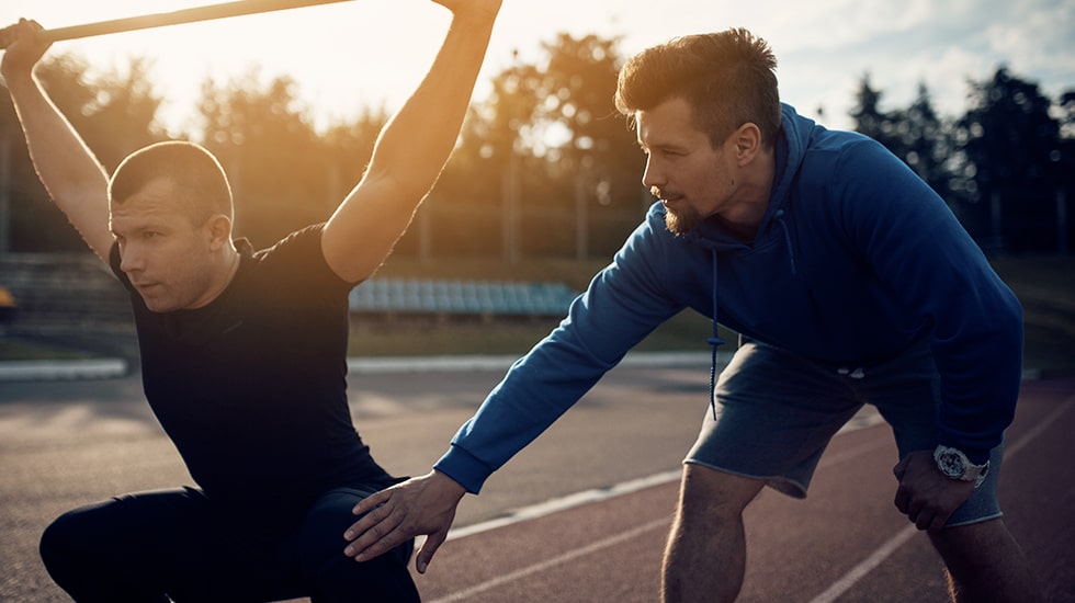 Photo coach sportif utilisant la solution de prise de rendez-vous en ligne Planner By Linkeo